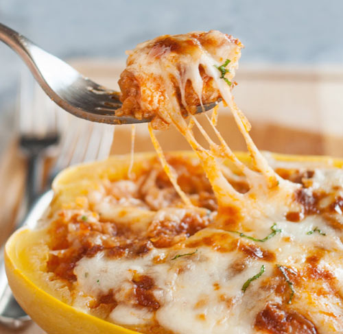 A bowl of hot-baked gooey goodness that you get all to yourself, no sharing required: Lasagna-Stuffed Spaghetti Squash