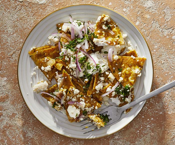 Zesty, crispy, saucy chilaquiles are the answer to your nachos craving: Like enchiladas, but lighter, simpler and more snackable 
	
	