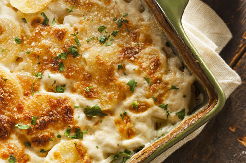 Creamy layers of potatoes flavored with sweet, thinly sliced onion rings, gooey cheese and a light crust:  Scalloped potatoes  are perfect comfort for blustery weather (Incl. tested techniques & tips) 