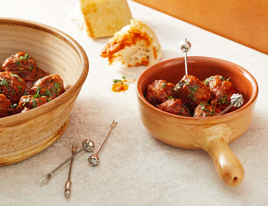 These Spanish-style meatballs -- bathed in a smoky, tangy tomato sauce --  are a lip-smacking dinner-at-the-ready; lean and well in the healthy zone, yet still moist and tender
  
  